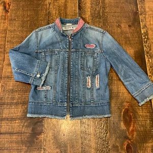 Frayed hem demon jean jacket with pink beading.